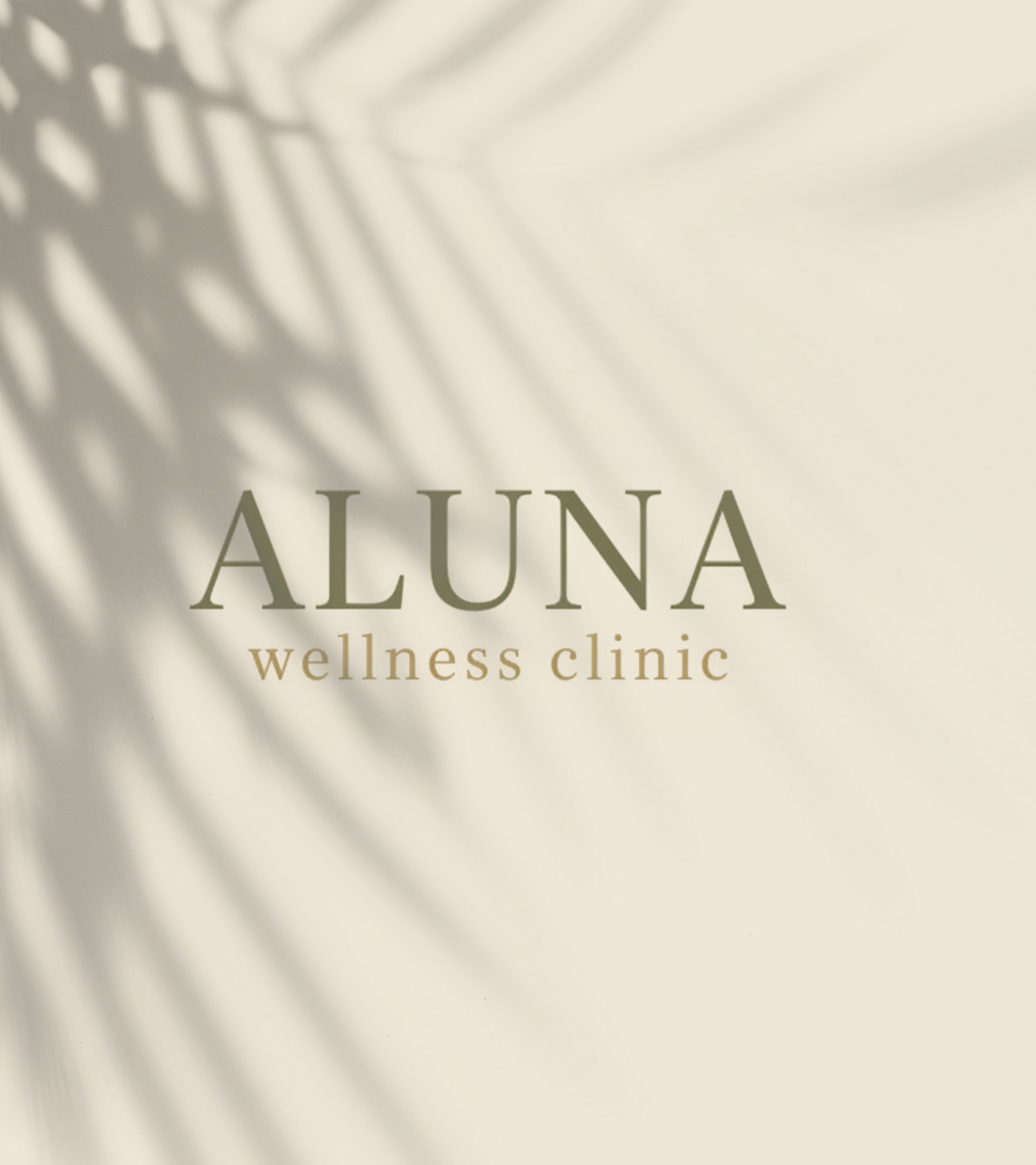 ALUNA wellness clinic wordmark in olive on warm ivory, crossed by soft palm-leaf shadows