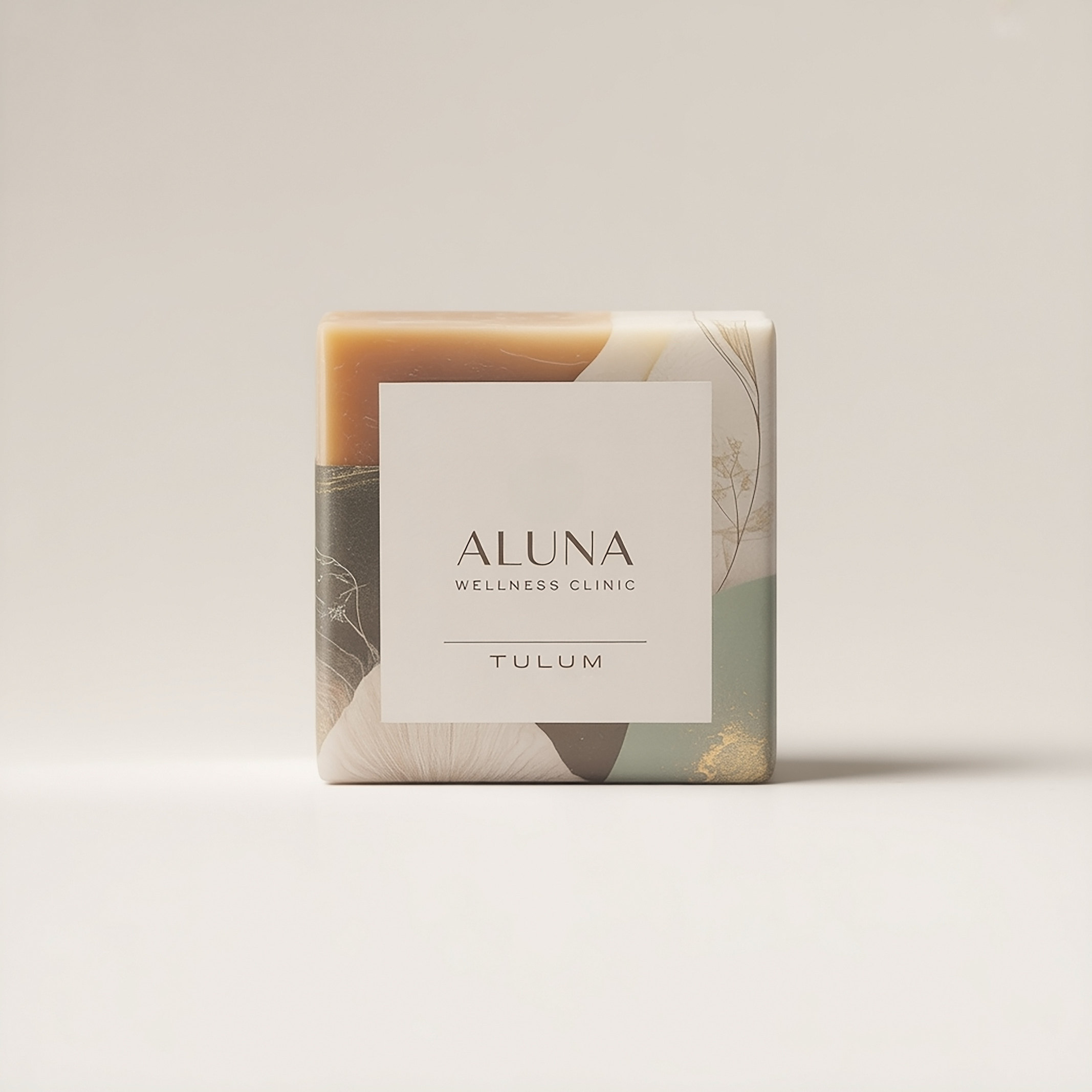 ALUNA wellness clinic soap with a botanical sage-and-ivory wrap and a Tulum label